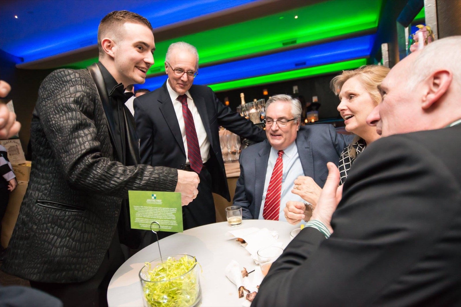 Chris Dare amazing a group of executives at a corporate lounge event